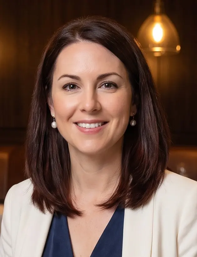 Portrait of Audrey Kessler, a character created for this guide; AI-generated image, not a photograph of a real person.